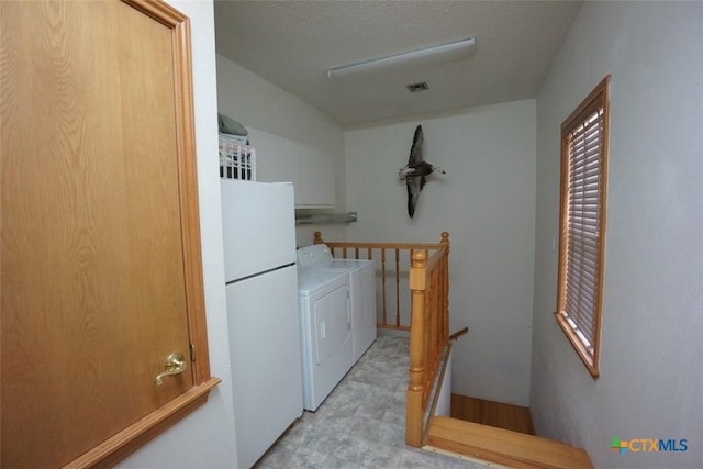 washroom with separate washer and dryer