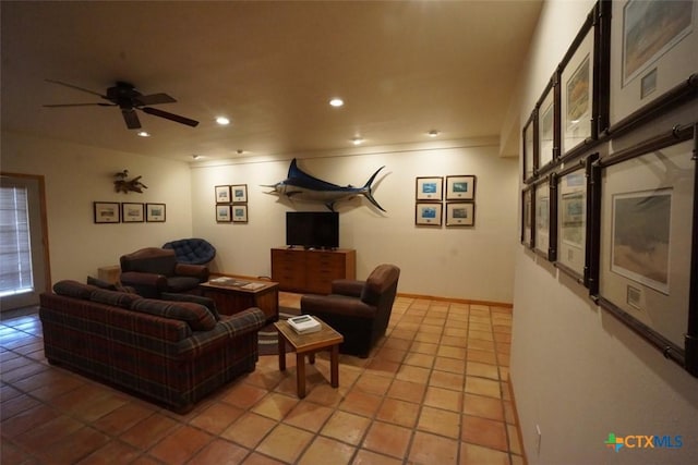 living room with ceiling fan and light tile patterned floors