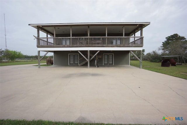 back of house with french doors and a wooden deck