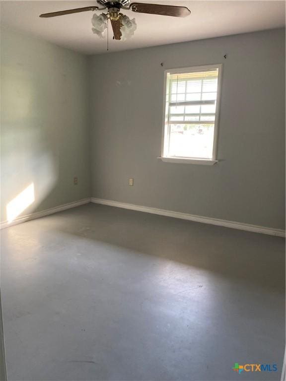 414 Henk Ln, San Marcos, TX 78666 - empty room with concrete flooring, ceiling fan, and baseboards