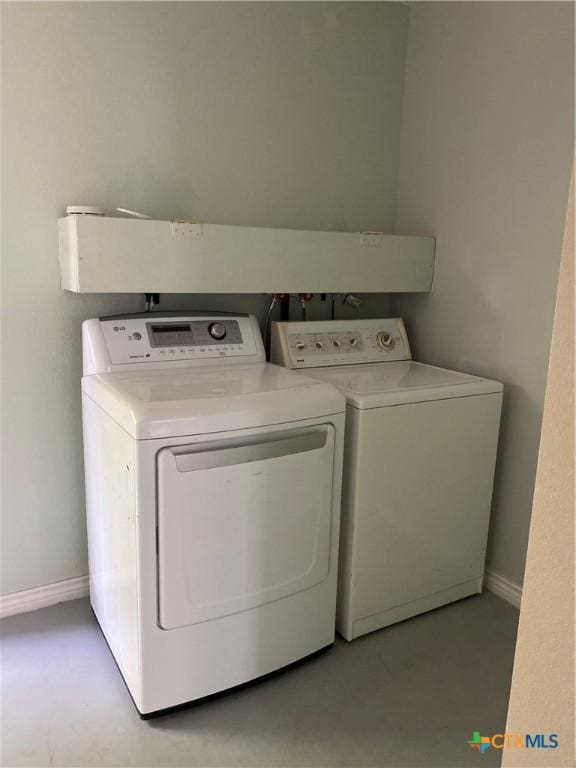 414 Henk Ln, San Marcos, TX 78666 - laundry room featuring laundry area, separate washer and dryer, and baseboards