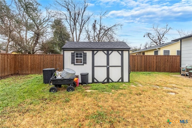 1011 Gilmore St, Taylor, TX 76574 - view of shed with a fenced backyard