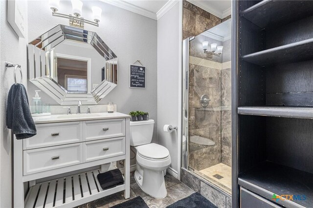 1011 Gilmore St, Taylor, TX 76574 - bathroom with crown molding, a stall shower, baseboards, toilet, and vanity