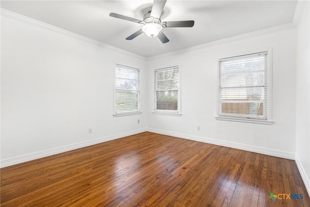 1011 Gilmore St, Taylor, TX 76574 - unfurnished room with wood finished floors, crown molding, a ceiling fan, and baseboards