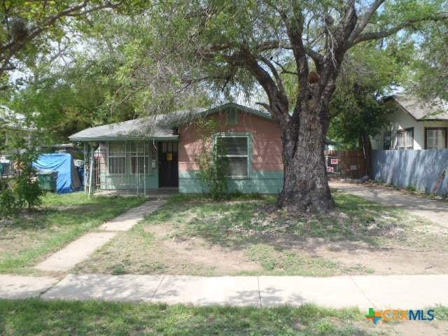view of front of home featuring fence
