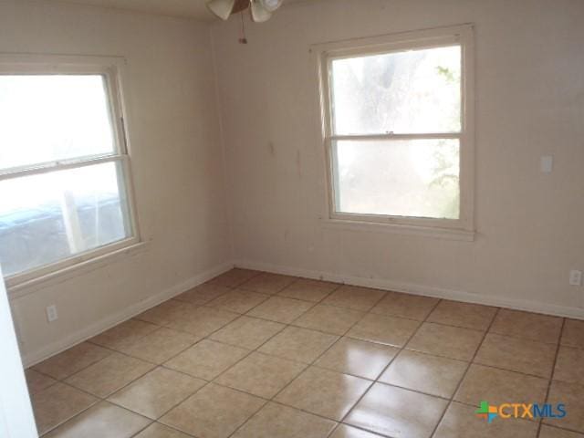 335 Hot Wells Blvd, San Antonio, TX 78223 - spare room with a ceiling fan and light tile patterned flooring