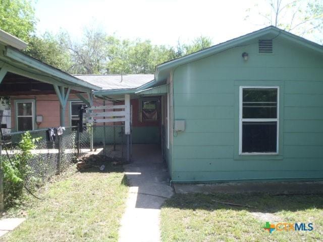view of property exterior with fence