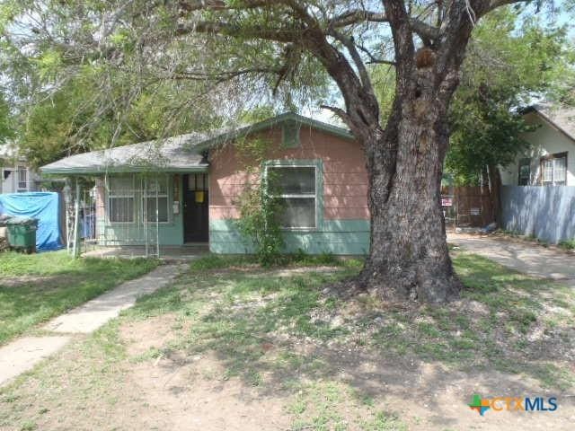 view of front of house with fence