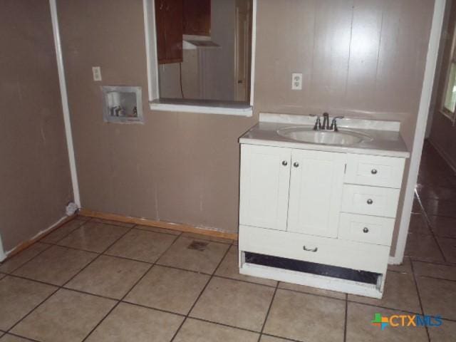335 Hot Wells Blvd, San Antonio, TX 78223 - bathroom with tile patterned flooring and vanity