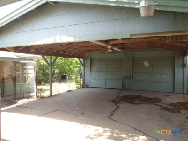 view of vehicle parking with a garage