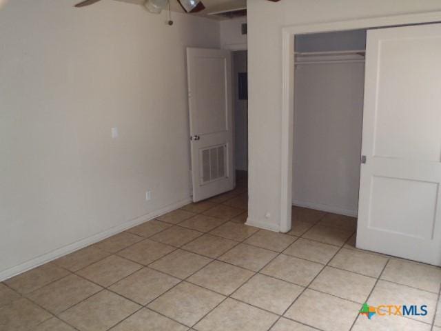 335 Hot Wells Blvd, San Antonio, TX 78223 - unfurnished bedroom with light tile patterned floors and a closet