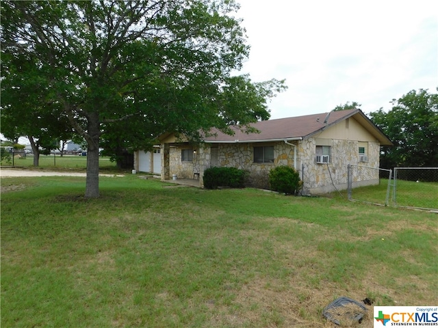 view of side of home with a lawn