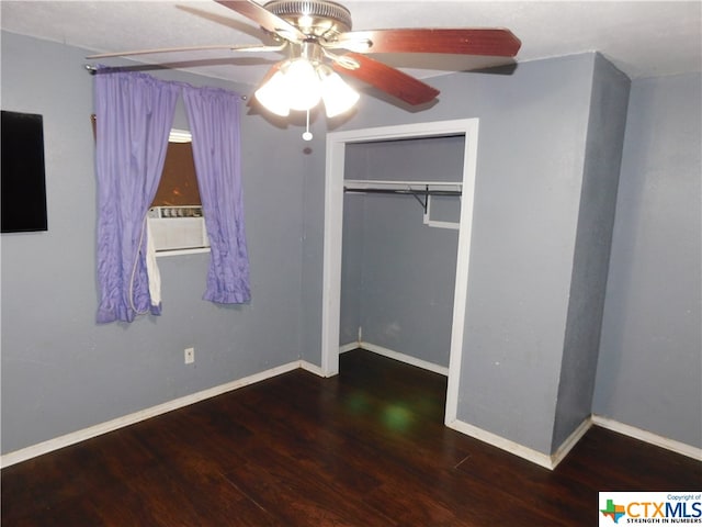 unfurnished bedroom featuring hardwood / wood-style floors, ceiling fan, and a closet