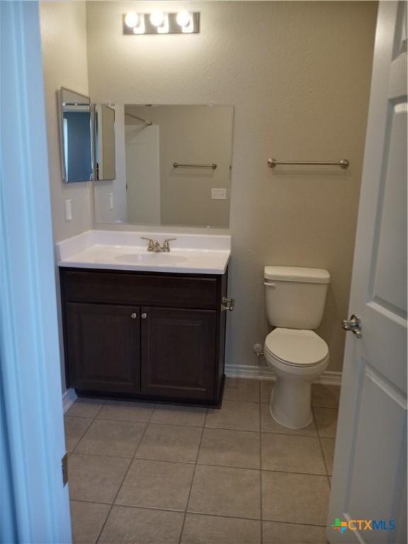 2703 Cardinal St, Victoria, TX 77901 - bathroom featuring vanity and tile patterned floors