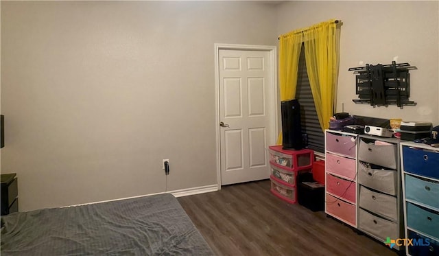 2703 Cardinal St, Victoria, TX 77901 - bedroom with dark wood-type flooring and baseboards