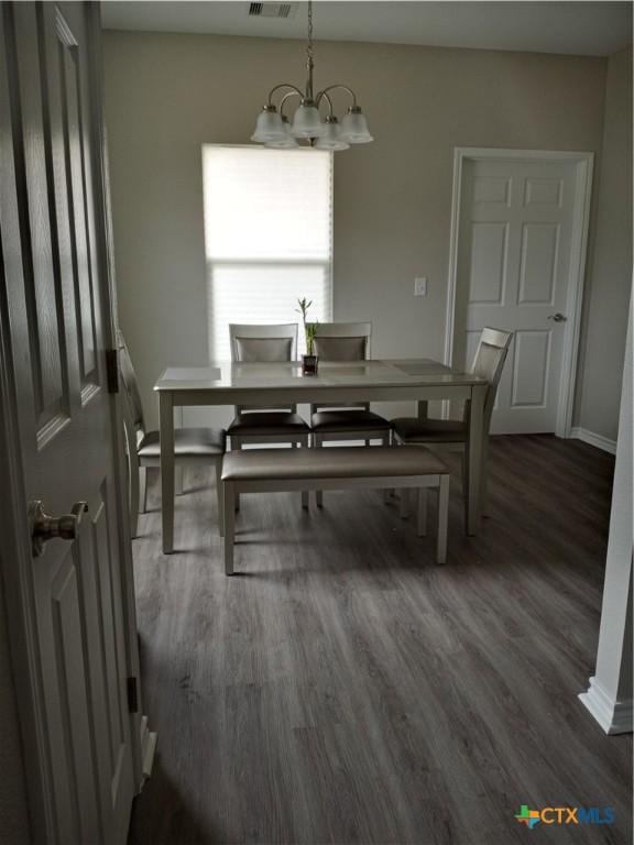 2703 Cardinal St, Victoria, TX 77901 - dining room featuring a chandelier and wood finished floors