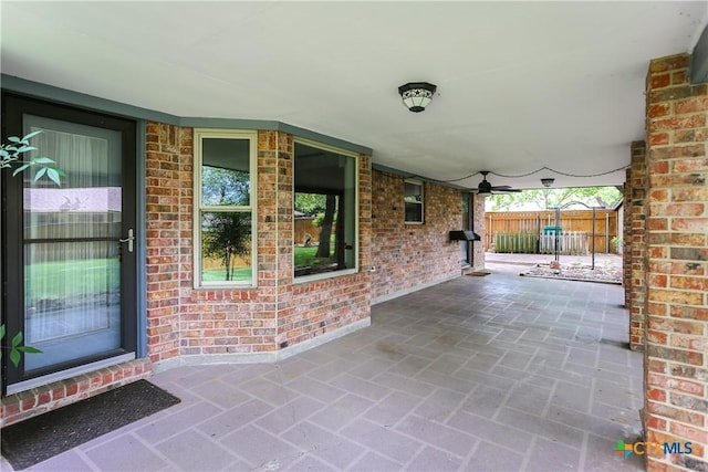 view of patio / terrace featuring fence