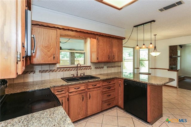 kitchen with black appliances, a sink, backsplash, a peninsula, and light tile patterned flooring