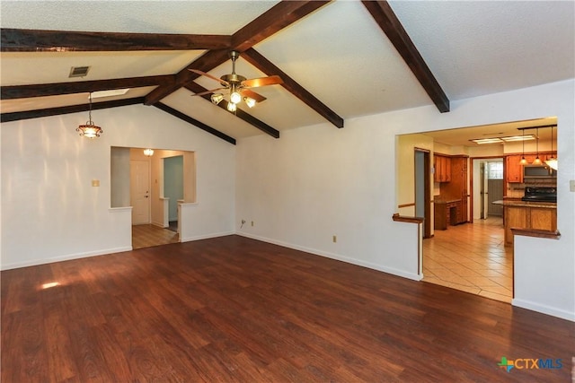 unfurnished living room featuring wood finished floors, a ceiling fan, and baseboards