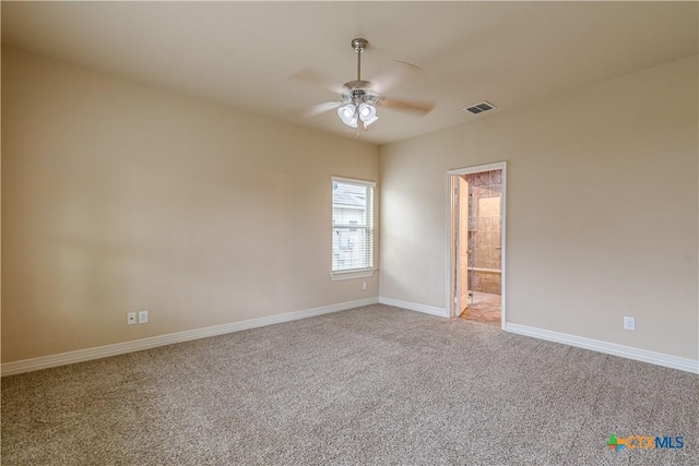 empty room featuring carpet flooring and ceiling fan