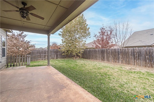 view of yard with a patio and ceiling fan