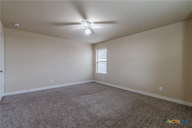 empty room with ceiling fan and carpet floors