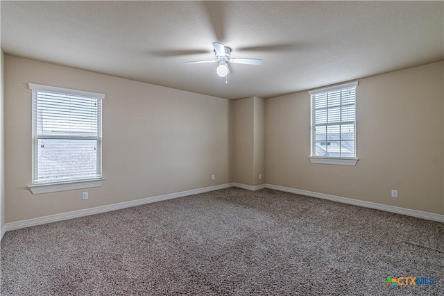 spare room with carpet flooring and ceiling fan