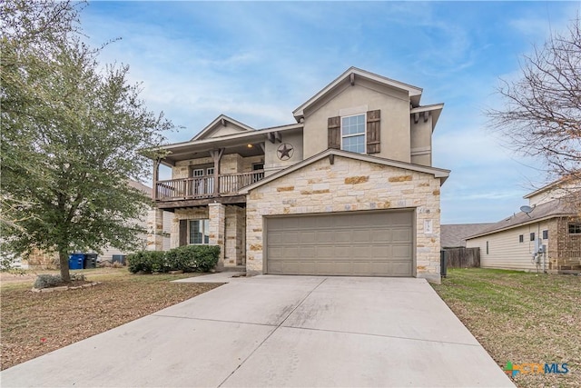 view of front of property featuring a balcony, a garage, and a front lawn