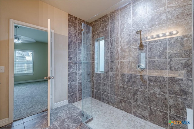 bathroom featuring a tile shower and tile patterned floors