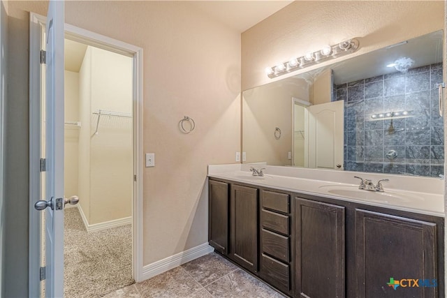 bathroom with tile patterned flooring and vanity