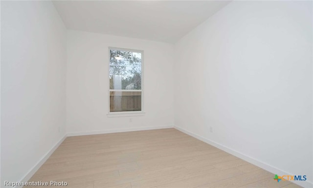 spare room with light wood-type flooring