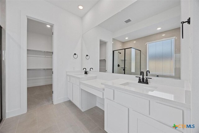 spacious closet with light colored carpet