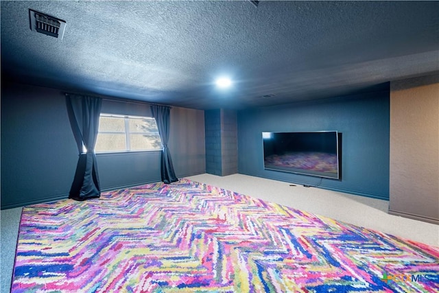 carpeted bedroom with a textured ceiling