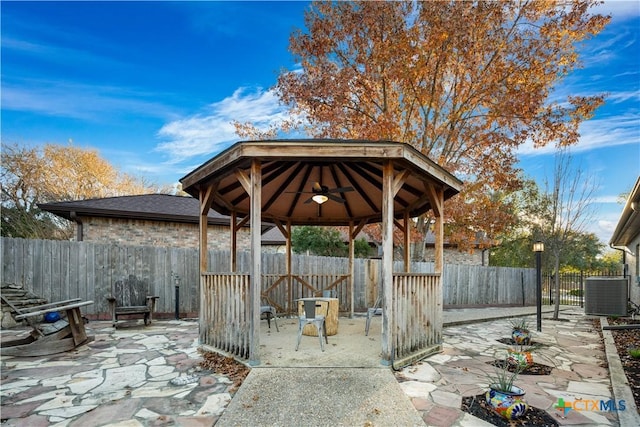 view of patio / terrace with cooling unit, a gazebo, and ceiling fan