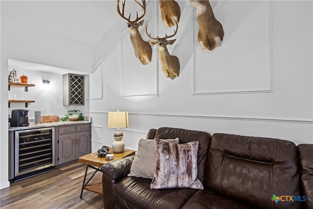 701 W Esparada Dr, Georgetown, TX 78628 - living area featuring wine cooler, wet bar, and light wood-type flooring