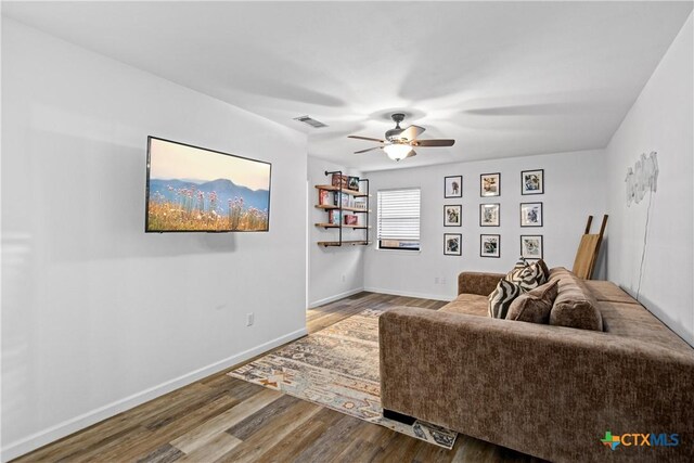 701 W Esparada Dr, Georgetown, TX 78628 - living room featuring wood finished floors, ceiling fan, and baseboards
