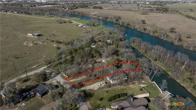 2021 Chinaberry Ln, New Braunfels, TX 78130 - view of property location with a large body of water, property boundaries highlighted, and rural landscape