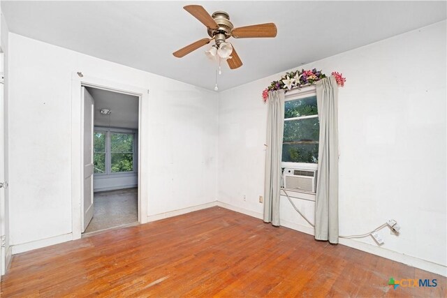 2021 Chinaberry Ln, New Braunfels, TX 78130 - unfurnished room with light wood-type flooring, cooling unit, and ceiling fan