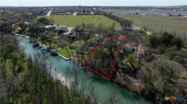 2021 Chinaberry Ln, New Braunfels, TX 78130 - aerial view of sparsely populated area with a nearby body of water and property boundaries highlighted