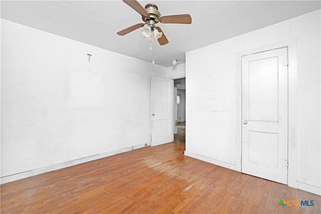 2021 Chinaberry Ln, New Braunfels, TX 78130 - unfurnished bedroom with wood finished floors and a ceiling fan
