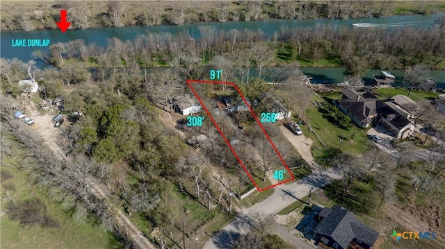 2021 Chinaberry Ln, New Braunfels, TX 78130 - aerial view of property and surrounding area featuring a large body of water and property boundaries highlighted