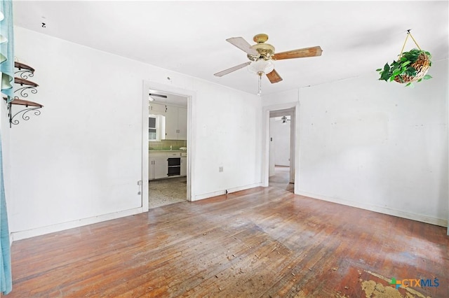 2021 Chinaberry Ln, New Braunfels, TX 78130 - unfurnished room with hardwood / wood-style flooring and ceiling fan
