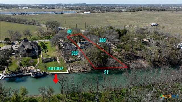 2021 Chinaberry Ln, New Braunfels, TX 78130 - overview of rural landscape featuring property parcel outlined and a large body of water