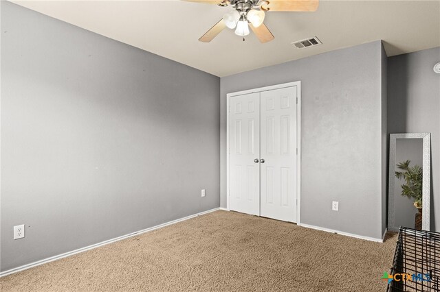 2307 Scott Dr, Copperas Cove, TX 76522 - unfurnished bedroom with carpet floors, baseboards, a closet, and a ceiling fan