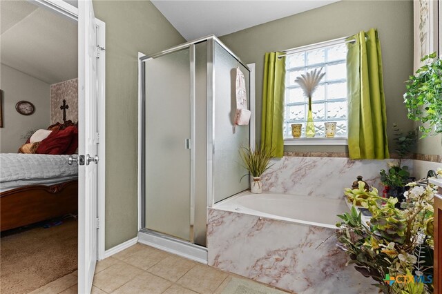 2307 Scott Dr, Copperas Cove, TX 76522 - bathroom with connected bathroom, a stall shower, a garden tub, tile patterned flooring, and lofted ceiling