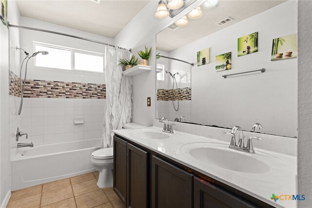 2307 Scott Dr, Copperas Cove, TX 76522 - full bath featuring shower / bathtub combination with curtain, toilet, double vanity, and tile patterned flooring