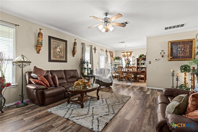 2307 Scott Dr, Copperas Cove, TX 76522 - living room with a ceiling fan, ornamental molding, dark wood-style flooring, a chandelier, and baseboards