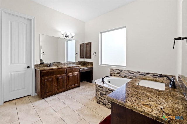 200 Tate Ln, Round Rock, TX 78626 - full bathroom with two vanities, a garden tub, and tile patterned flooring