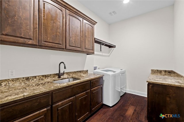 200 Tate Ln, Round Rock, TX 78626 - laundry room with cabinet space, dark wood-style flooring, and washing machine and clothes dryer