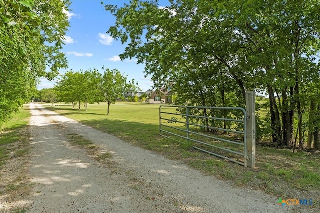 200 Tate Ln, Round Rock, TX 78626 - view of dirt / gravel road with a gated entry and a gate